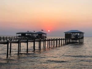 View of sunset and pier at Jubilee Suites in Fairhope, AL
